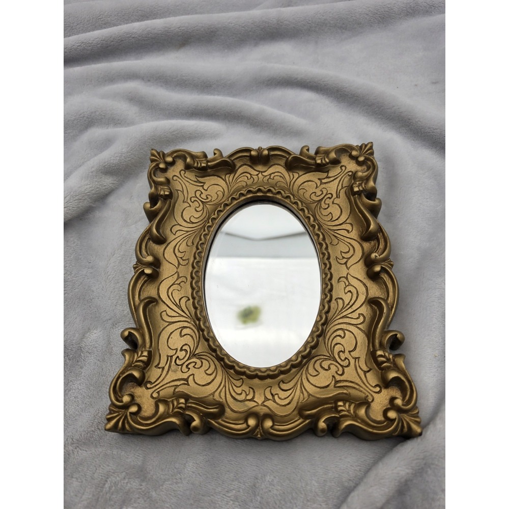 Vintage Oval Mirror In An Ornate Gold Victorian/Hollywood Regency Plastic Frame